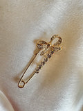 Bow brooch